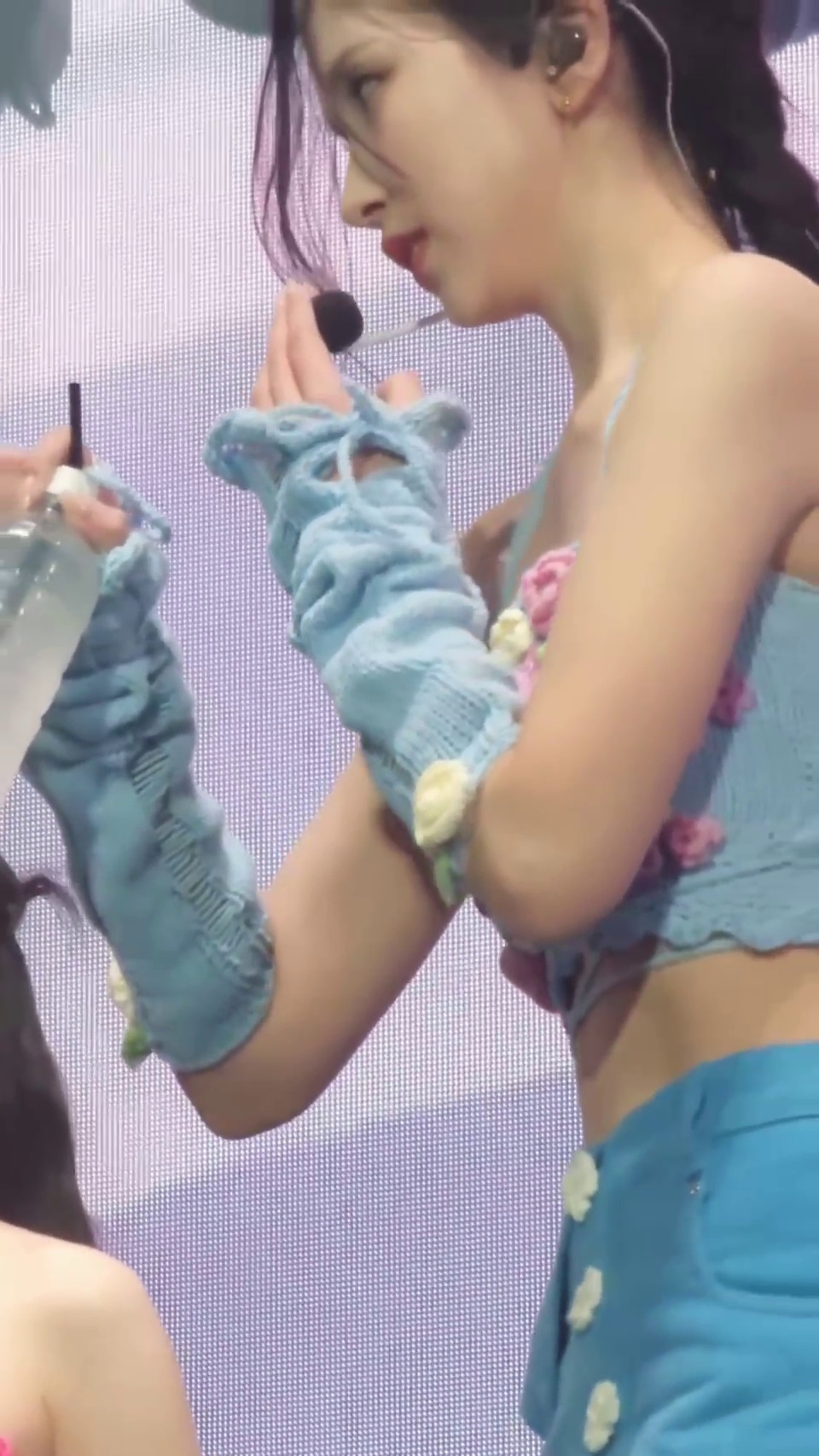 TWICE Mina, caught off guard while picking up a water bottle in a floral-decorated camisole