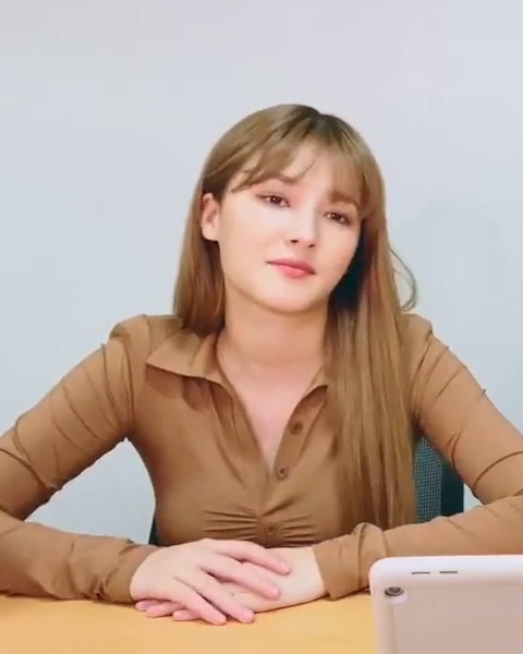 Nancy in Brown Shirt